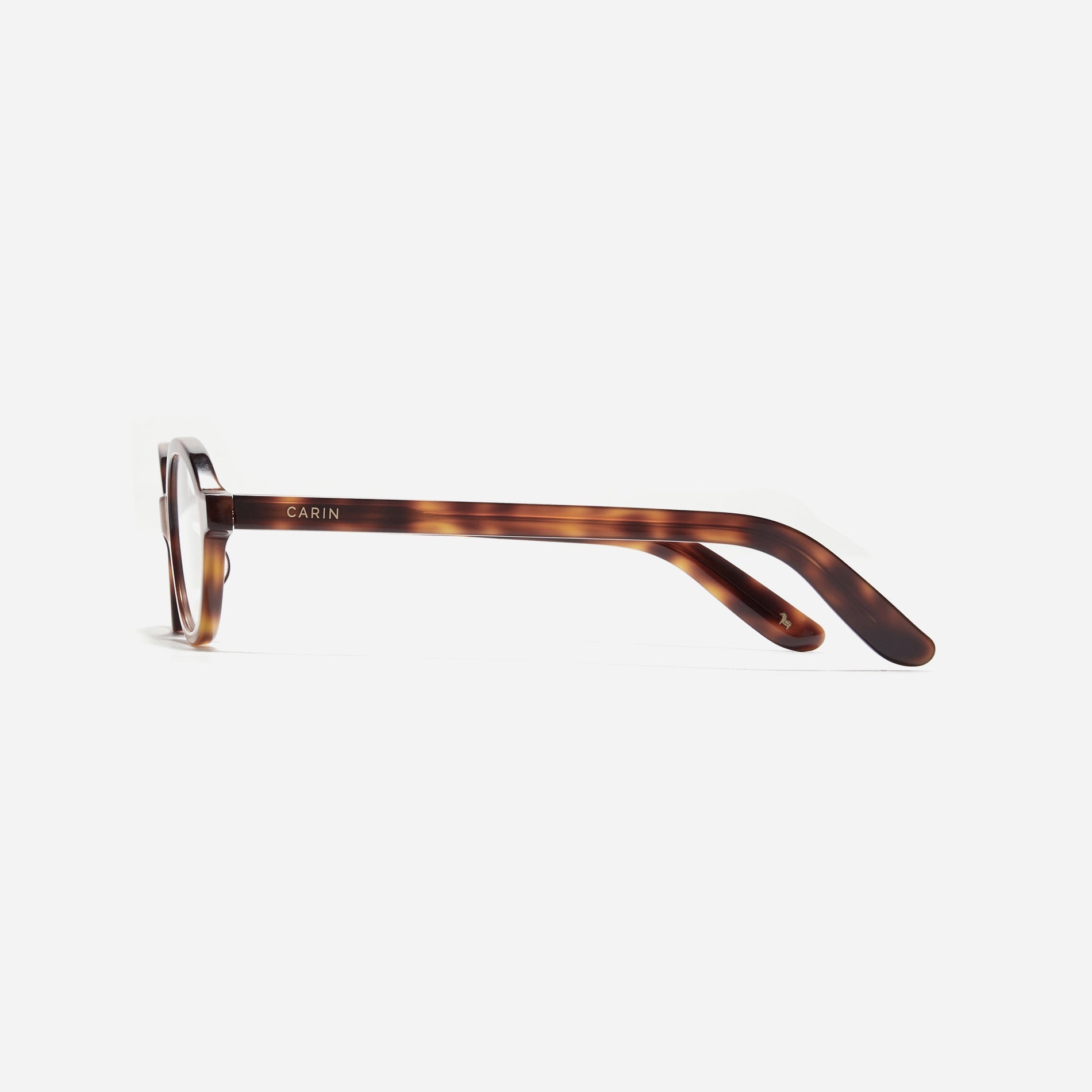 Compact, oval-shaped horn-rimmed eyeglasses featuring a narrow rim and bold frame. Their design captures a modern reinterpretation of 90s retro vibes, providing a trendy and stylish look.