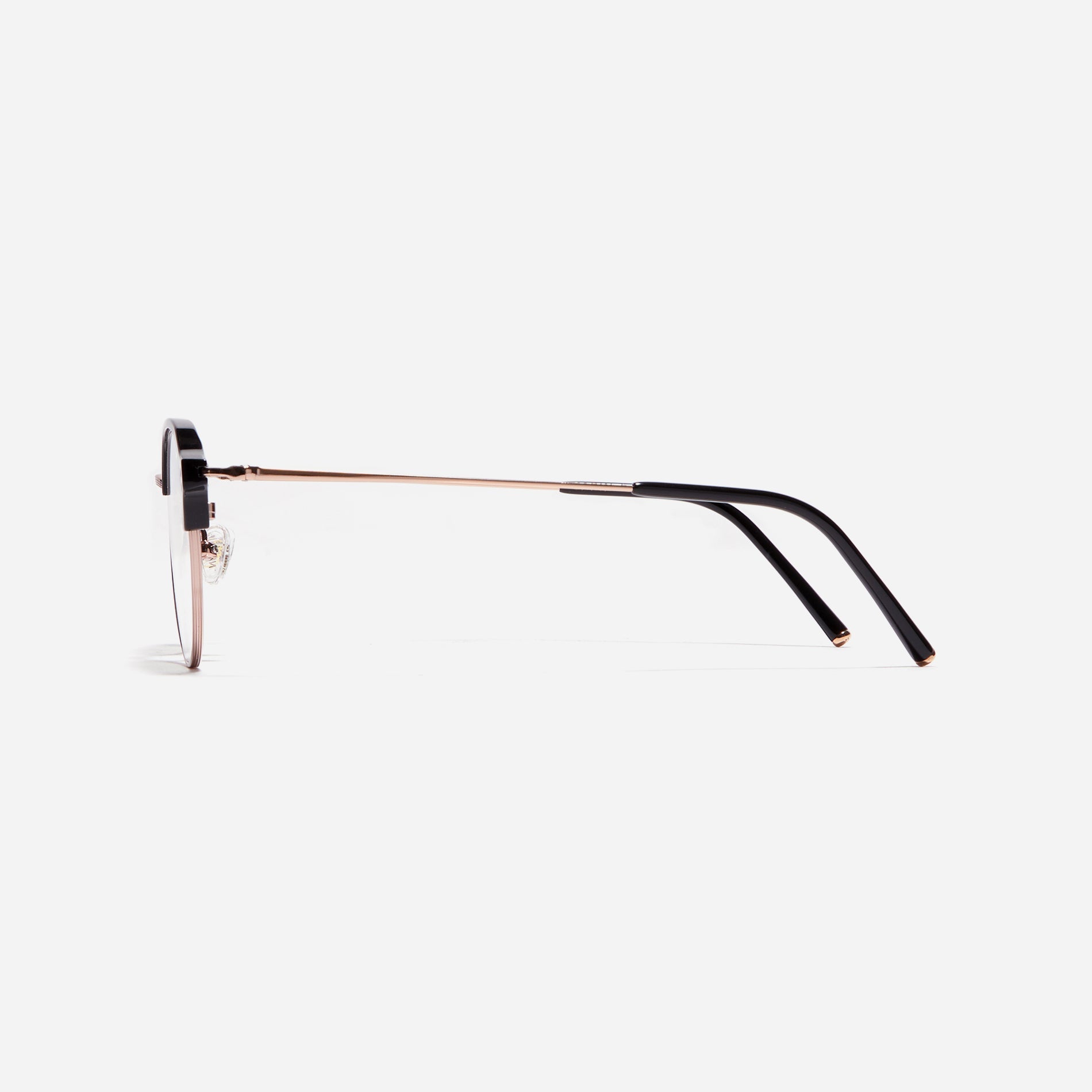 Polygonal-shaped gold-rimmed eyeglasses. The frame, constructed from bioplastic and titanium, seamlessly merges exceptional durability with an ultra-lightweight build, while stylish nose bridge lining details enhance the overall design. The B-titanium temples deliver a lightweight and comfortable fit, guaranteeing prolonged wear without any discomfort.