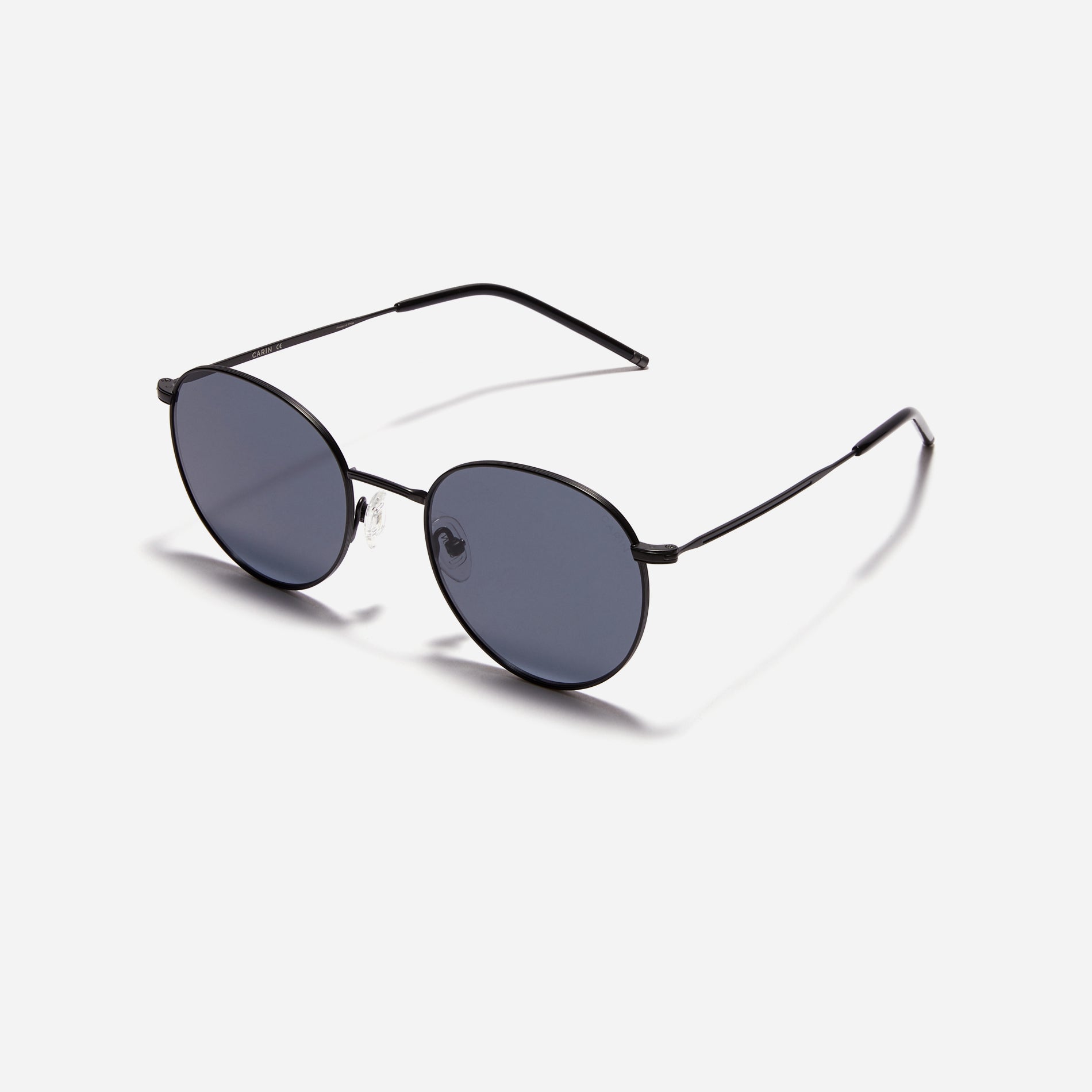 Round-shaped metal sunglasses that offer a soft and natural look with a peach-shaded titanium frame.
