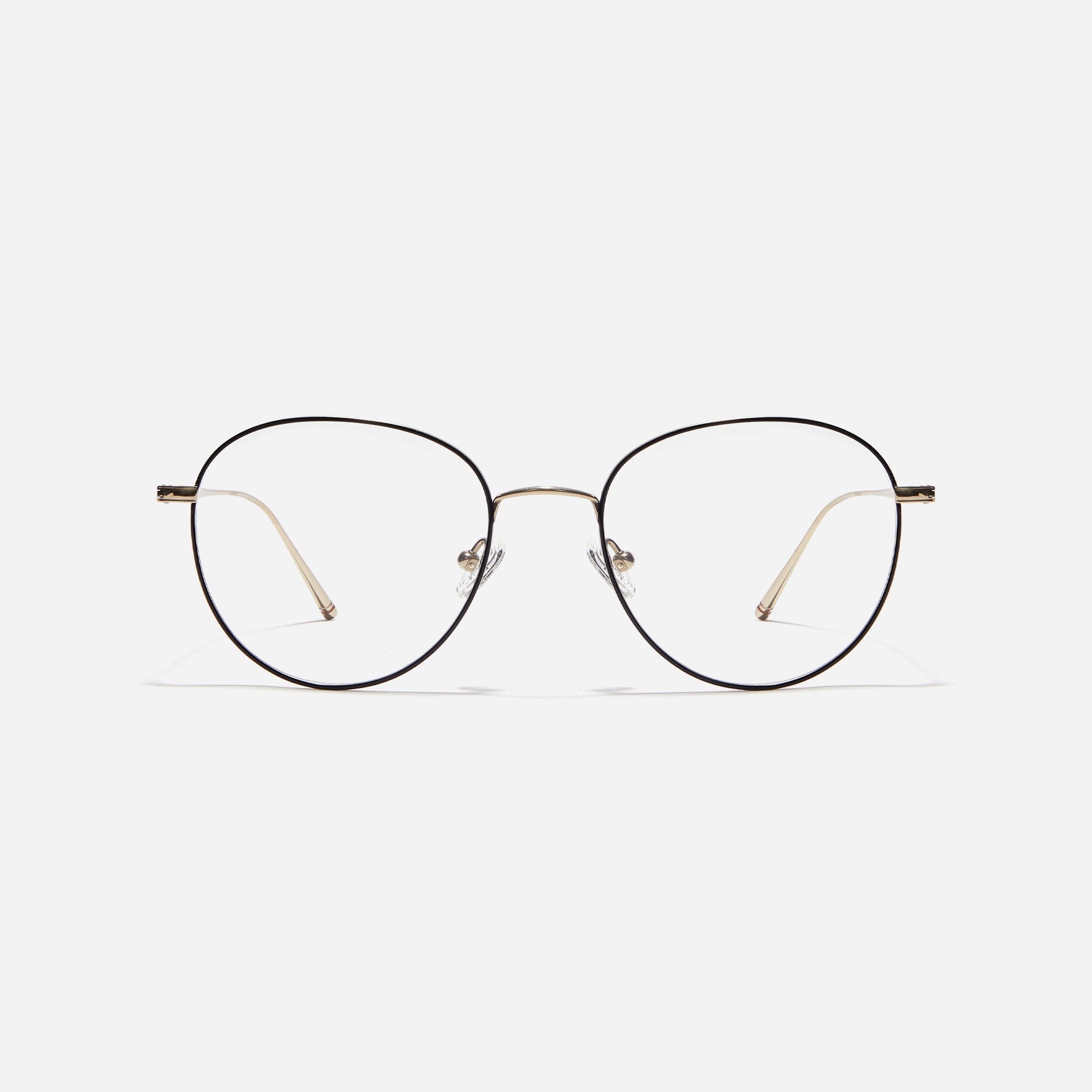 Boston-style round-shaped eyeglasses that naturally enhance one's facial features. Crafted entirely from titanium, they guarantee a lighter and more comfortable fit, while modern design makes them a perfect choice for those seeking a contemporary look.