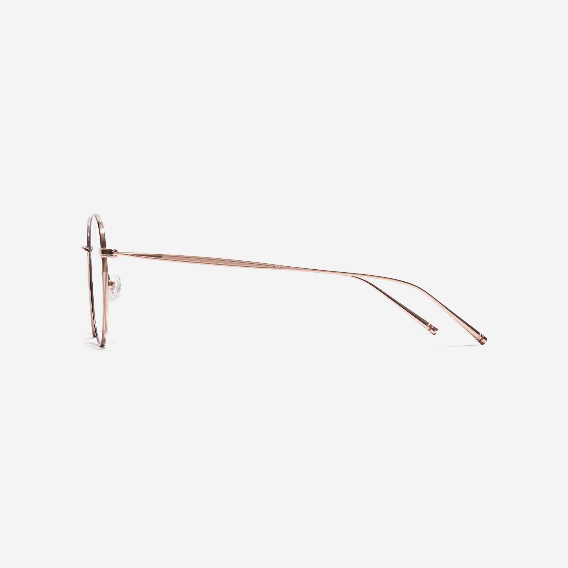 Boston-style round-shaped eyeglasses that naturally enhance one's facial features. Crafted entirely from titanium, they guarantee a lighter and more comfortable fit, while modern design makes them a perfect choice for those seeking a contemporary look.