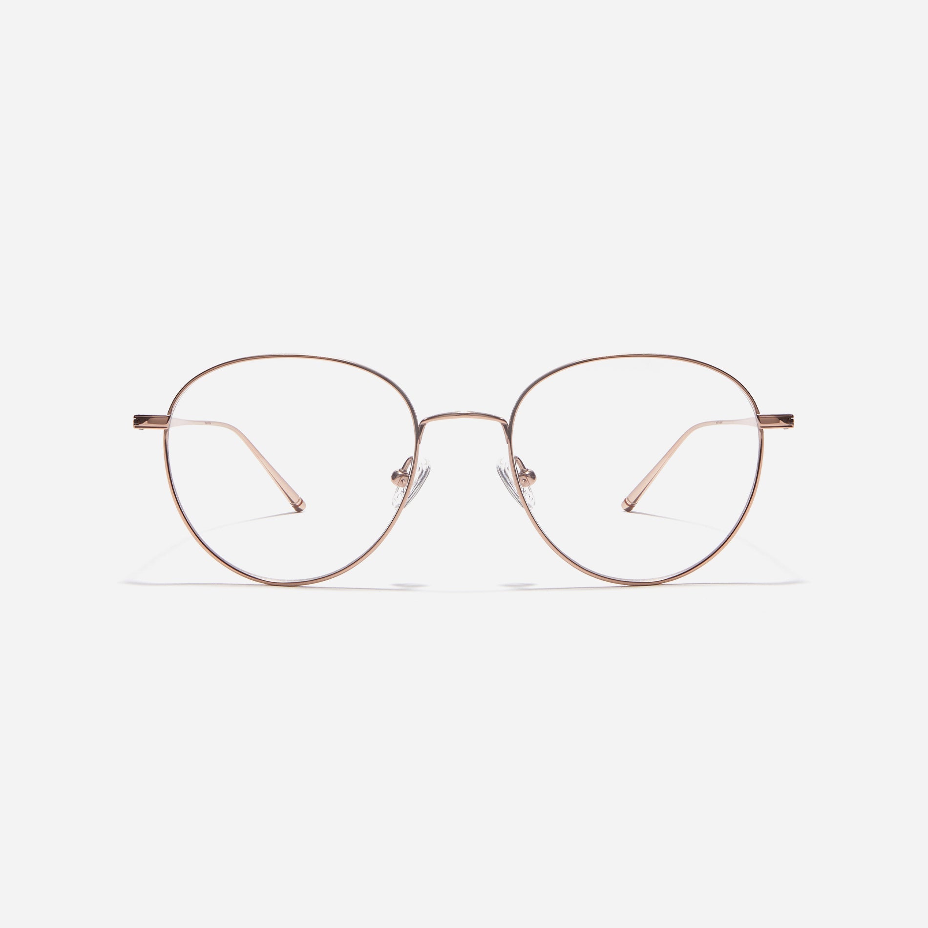Boston-style round-shaped eyeglasses that naturally enhance one's facial features. Crafted entirely from titanium, they guarantee a lighter and more comfortable fit, while modern design makes them a perfect choice for those seeking a contemporary look.