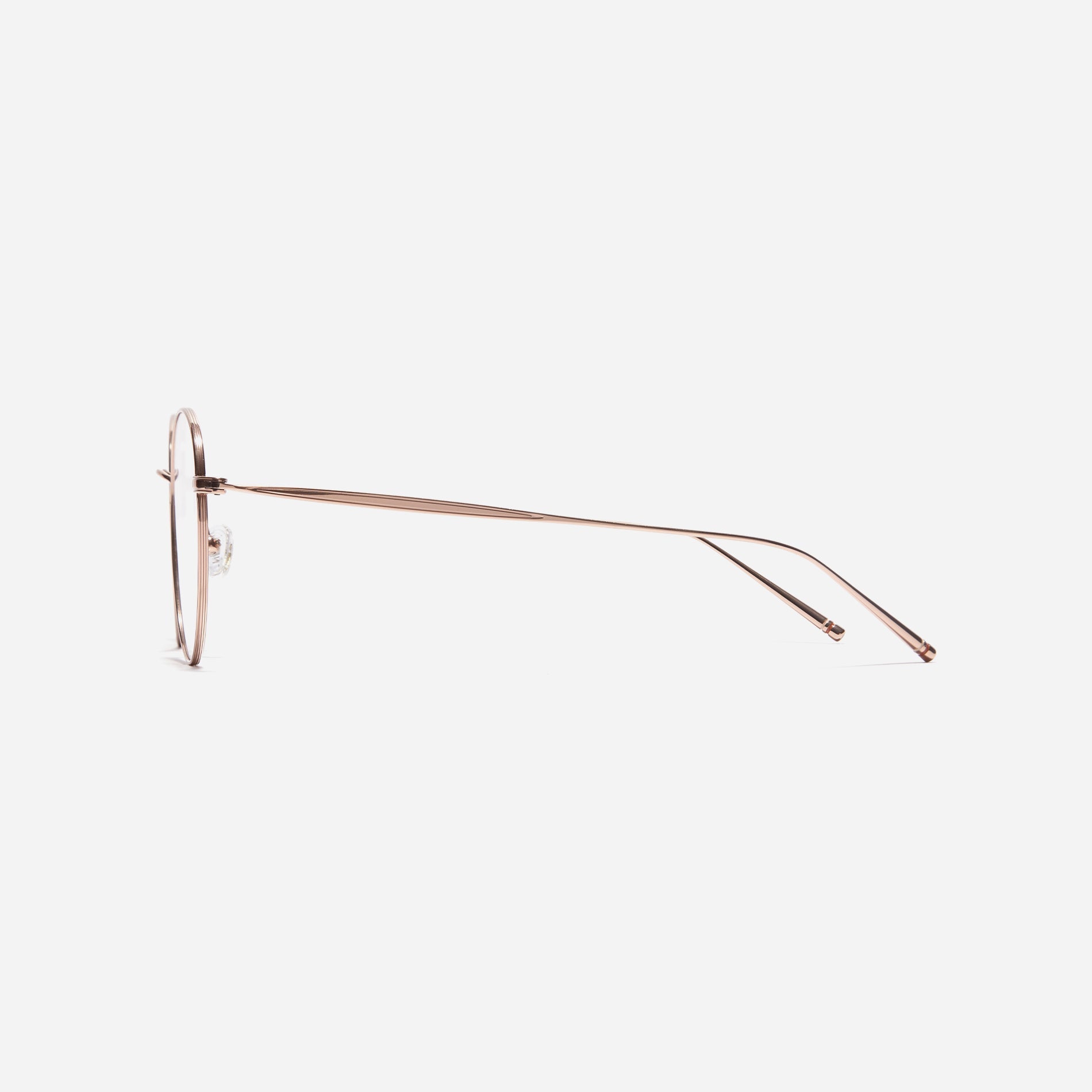 Boston-style round-shaped eyeglasses that naturally enhance one's facial features. Crafted entirely from titanium, they guarantee a lighter and more comfortable fit, while modern design makes them a perfect choice for those seeking a contemporary look.