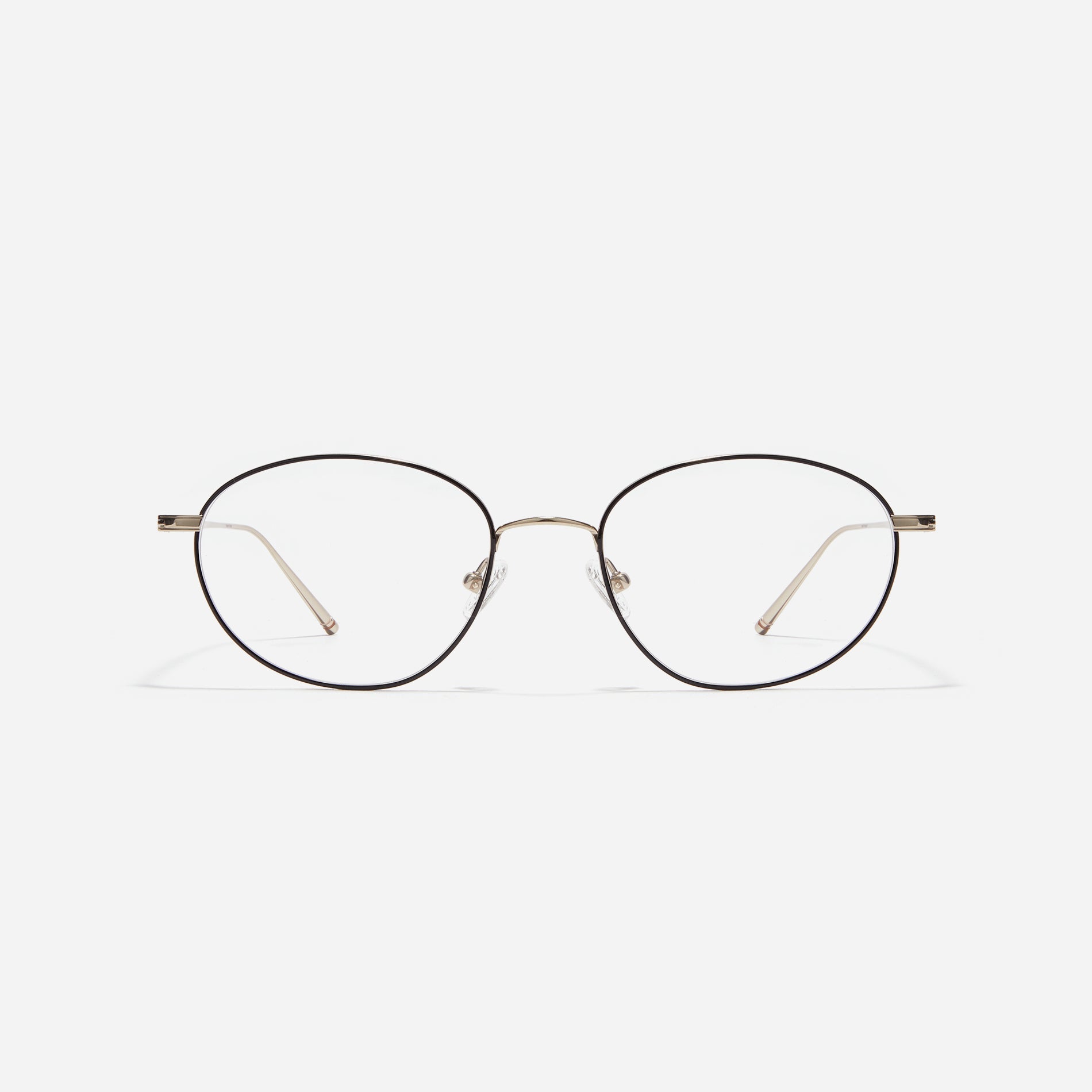 Stylish oval-shaped eyeglasses with slender rims. Crafted entirely from titanium, they guarantee a lighter and more comfortable fit. With a variety of colors available, Edell offers a fashionable style for both men and women.