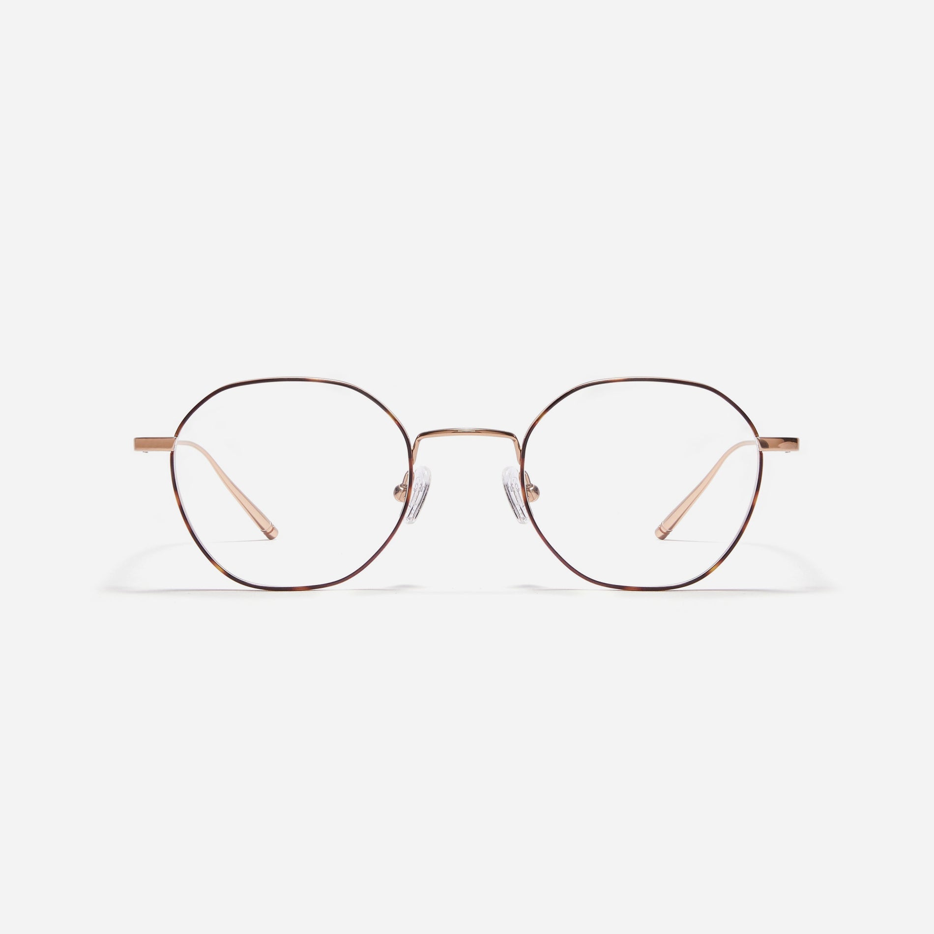 Hexagonal-shaped, full-metal eyeglasses with a dual-rim structure designed to accommodate thicker, high-prescription lenses. Both the frame and temples are made of pure titanium, ensuring a lightweight and comfortable fit.