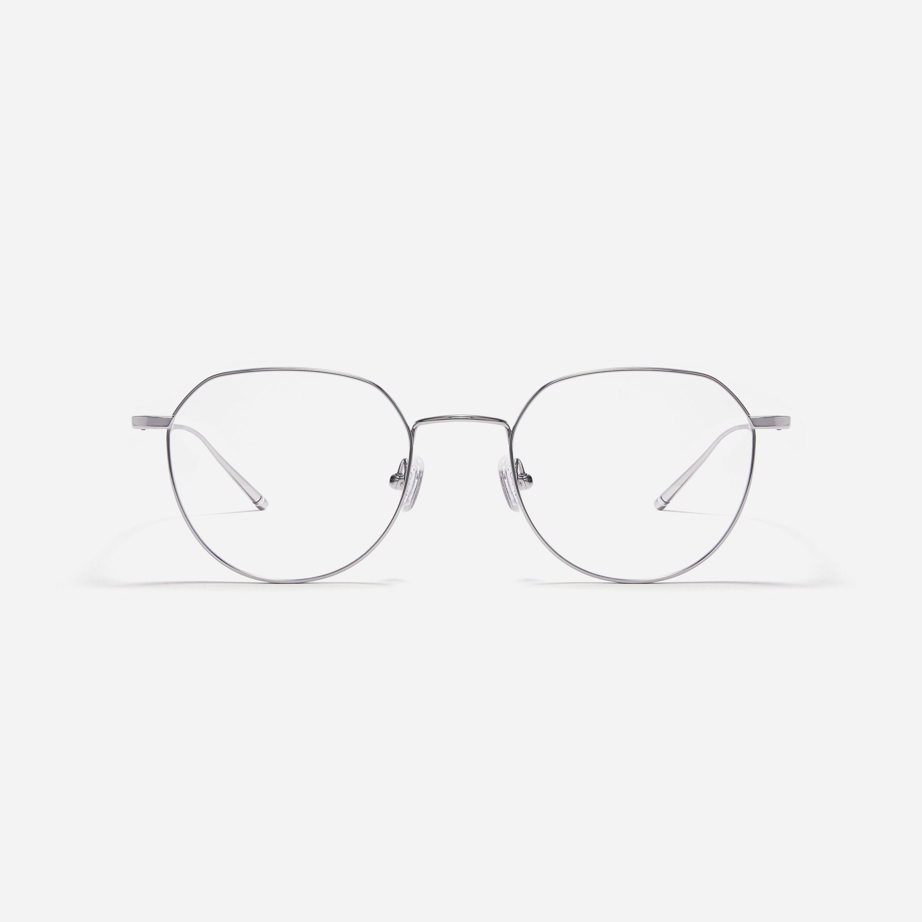 Polygonal-shaped, full-metal eyeglasses with a dual-rim structure designed to accommodate thicker, high-prescription lenses. Both the frame and temples are made of pure titanium, ensuring a lightweight and comfortable fit.