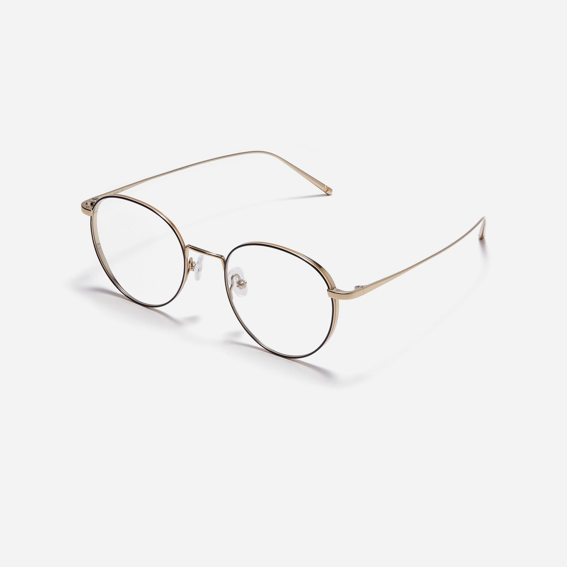 Round-shaped, full-metal eyeglasses with a dual-rim structure designed to accommodate thicker, high-prescription lenses. Both the frame and temples are made of pure titanium, ensuring a lightweight and comfortable fit.