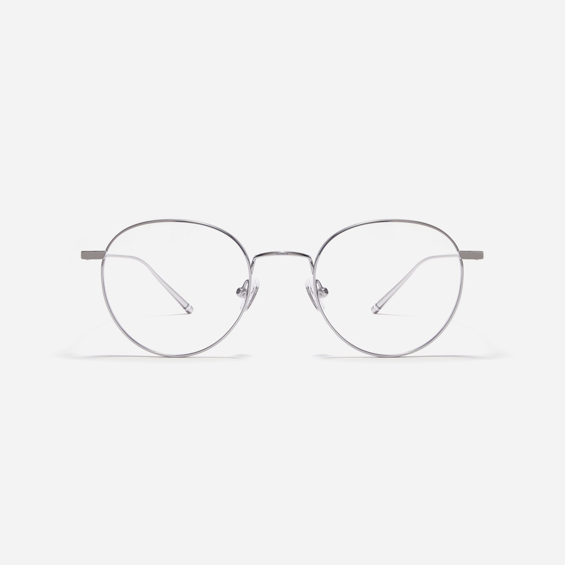Round-shaped, full-metal eyeglasses with a dual-rim structure designed to accommodate thicker, high-prescription lenses. Both the frame and temples are made of pure titanium, ensuring a lightweight and comfortable fit.