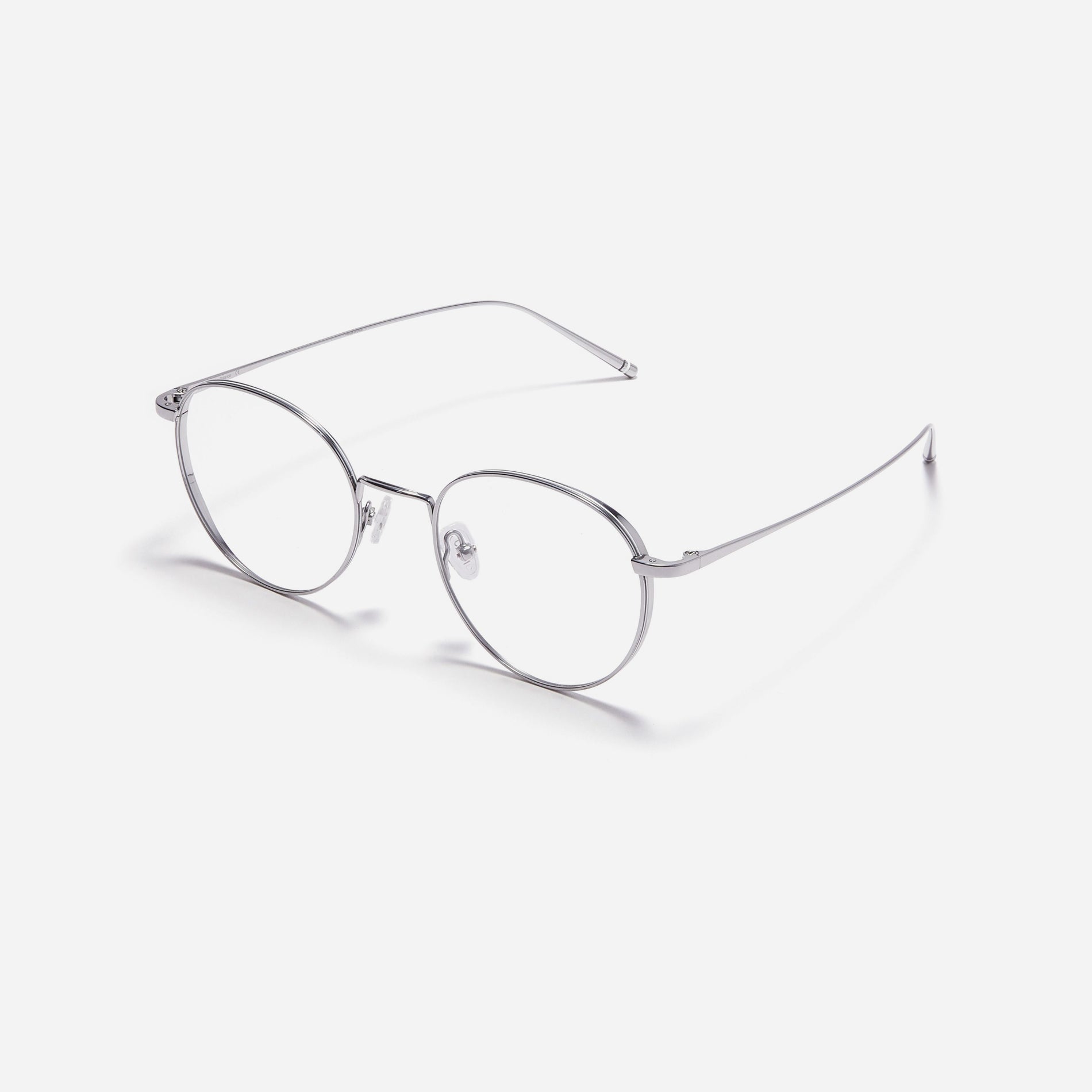 Round-shaped, full-metal eyeglasses with a dual-rim structure designed to accommodate thicker, high-prescription lenses. Both the frame and temples are made of pure titanium, ensuring a lightweight and comfortable fit.