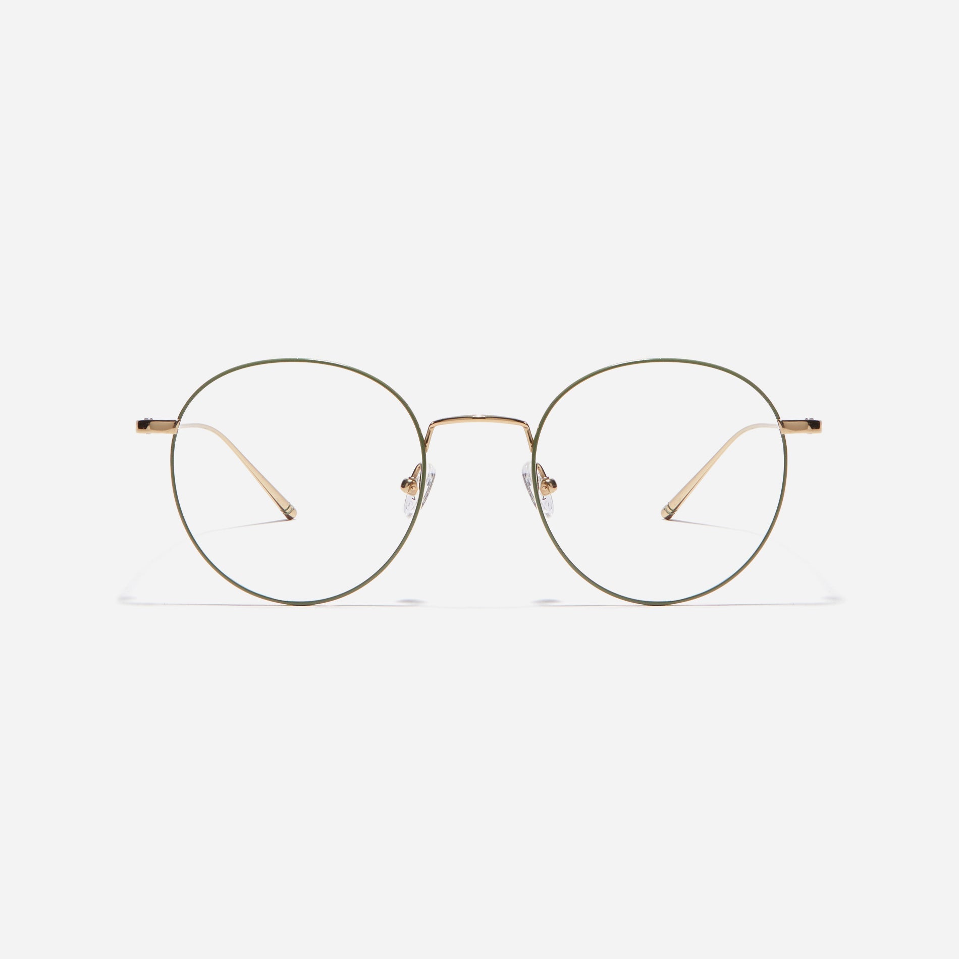 Round-shaped eyeglasses that naturally complement all face shapes. Crafted entirely from titanium, the frame provides exceptional durability and featherweight comfort, while its design adds a touch of casual charm to one's daily style.