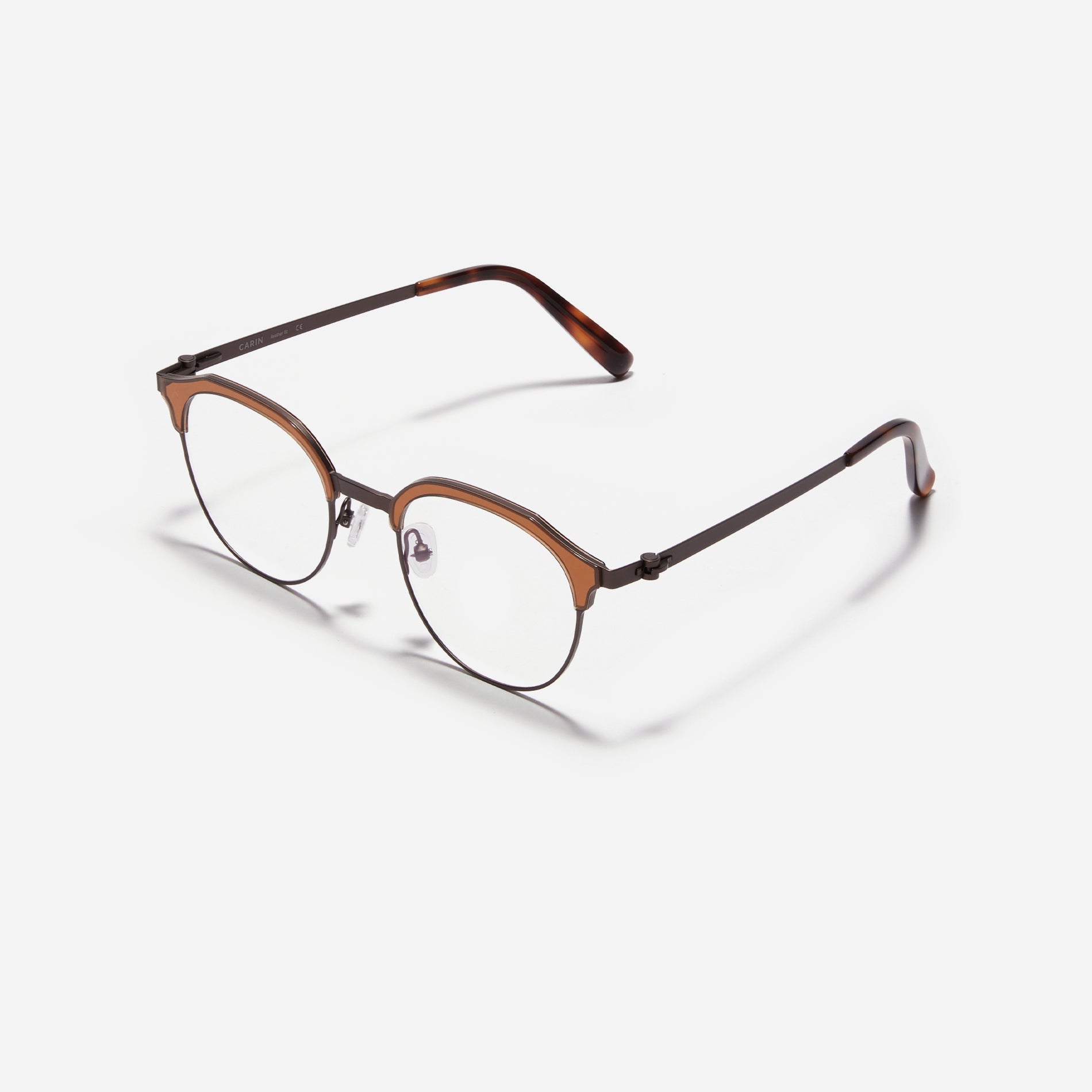 Lightweight polygon-shaped eyeglasses from CARIN's 'Feather Fit' line, offering a contemporary twist on the classic browline design.