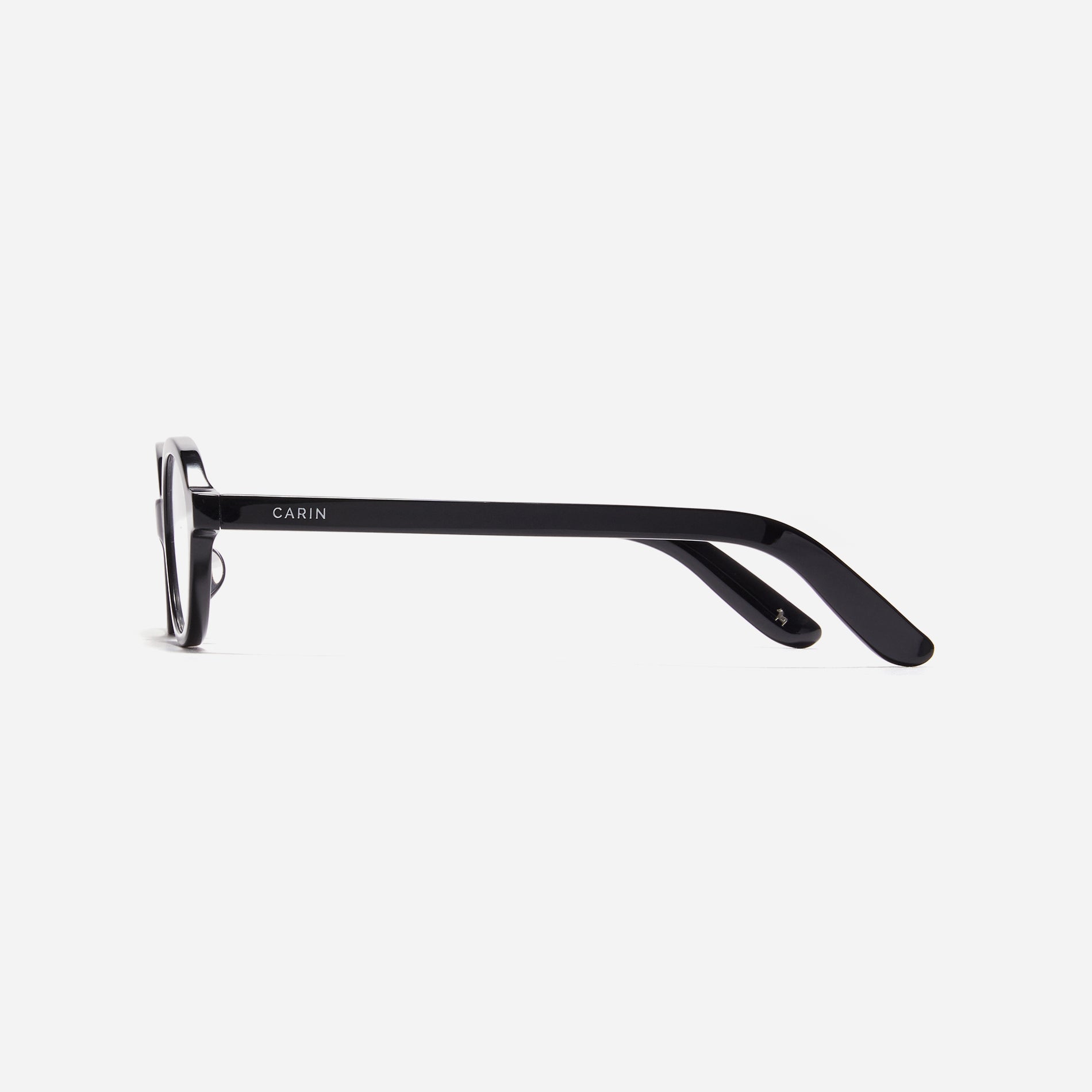 Compact, oval-shaped horn-rimmed eyeglasses featuring a narrow rim and bold frame. Their design captures a modern reinterpretation of 90s retro vibes, providing a trendy and stylish look.