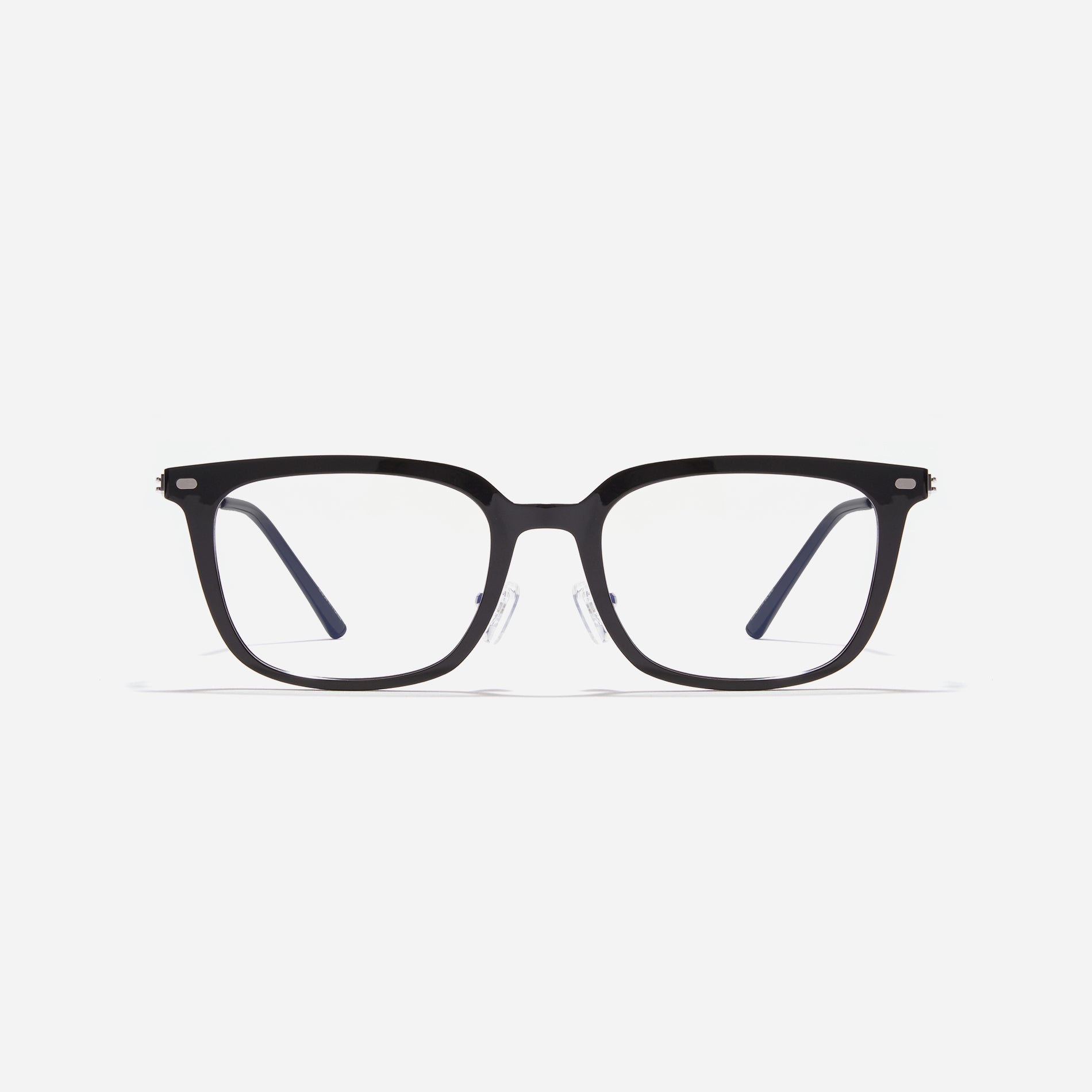 Square-shaped combination eyeglasses from CARIN's 'Feather Fit' line. Their combination frame seamlessly blends bio-plastic and titanium, utilizing advanced injection molding technology, often seen in the manufacturing of cell phones and watches. 