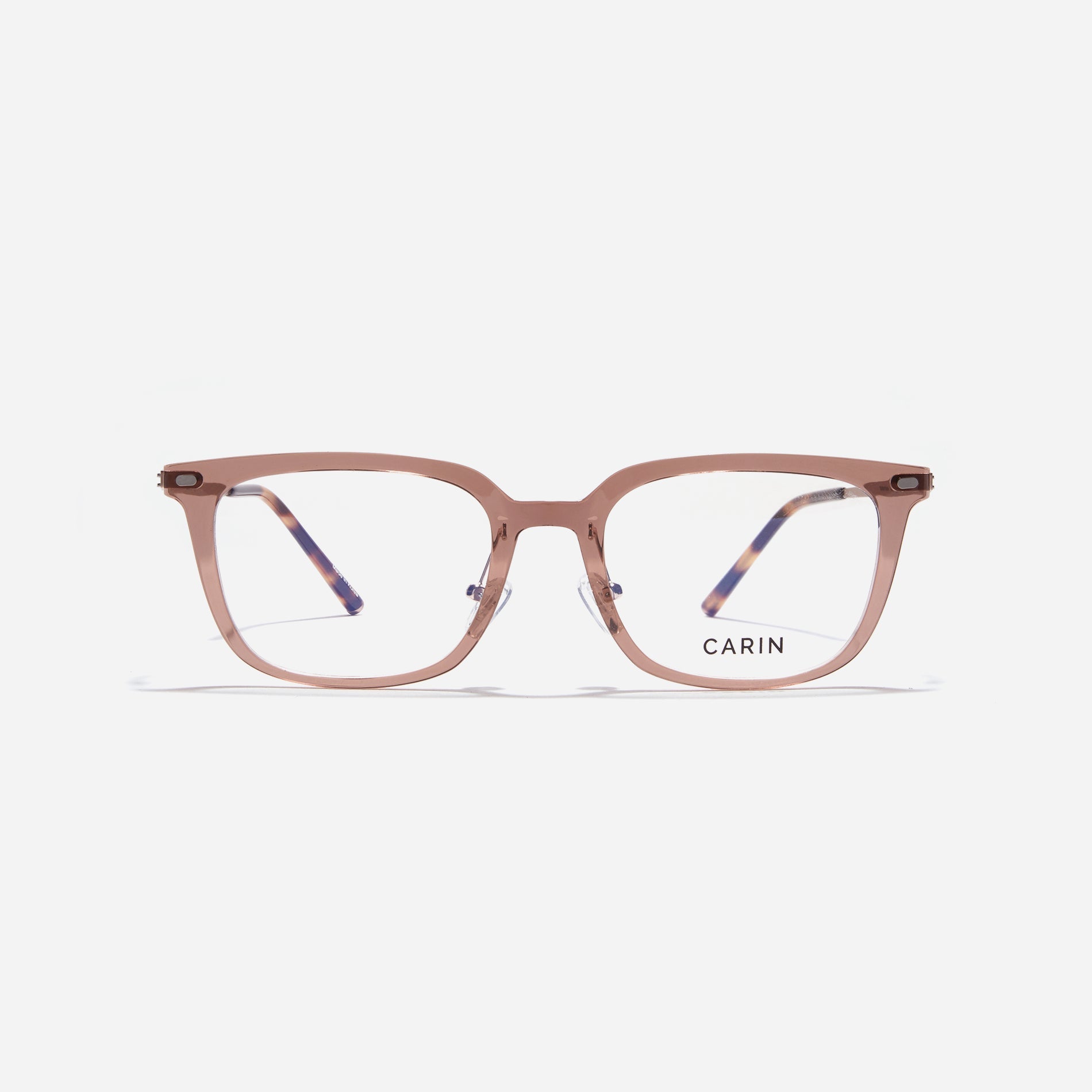 Square-shaped combination eyeglasses from CARIN's 'Feather Fit' line. Their combination frame seamlessly blends bio-plastic and titanium, utilizing advanced injection molding technology, often seen in the manufacturing of cell phones and watches. 