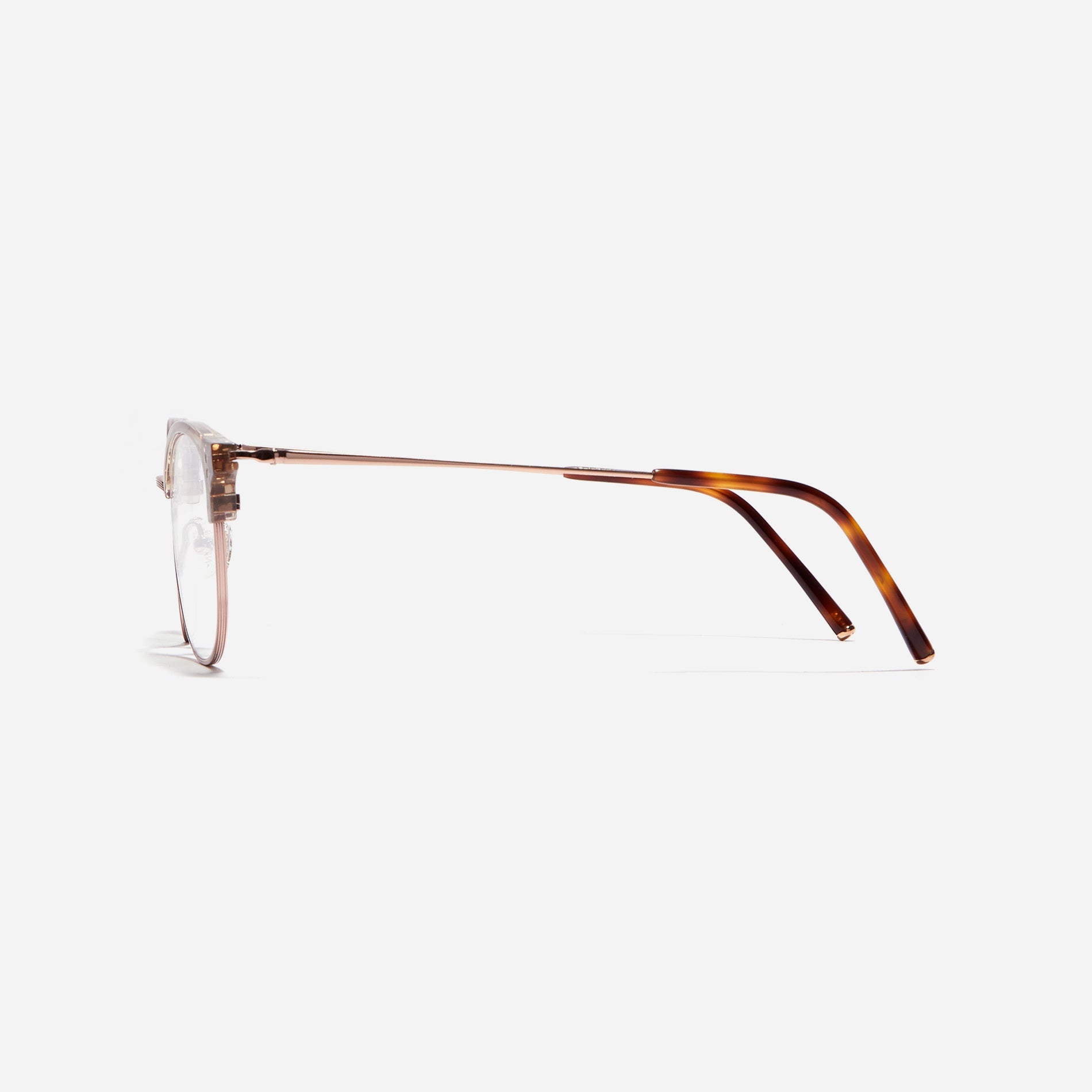 Square-shaped gold-rimmed eyeglasses. The frame, constructed from bioplastic and titanium, seamlessly merges exceptional durability with an ultra-lightweight build, while stylish nose bridge lining details enhance the overall design. The B-titanium temples deliver a lightweight and comfortable fit, guaranteeing prolonged wear without any discomfort.