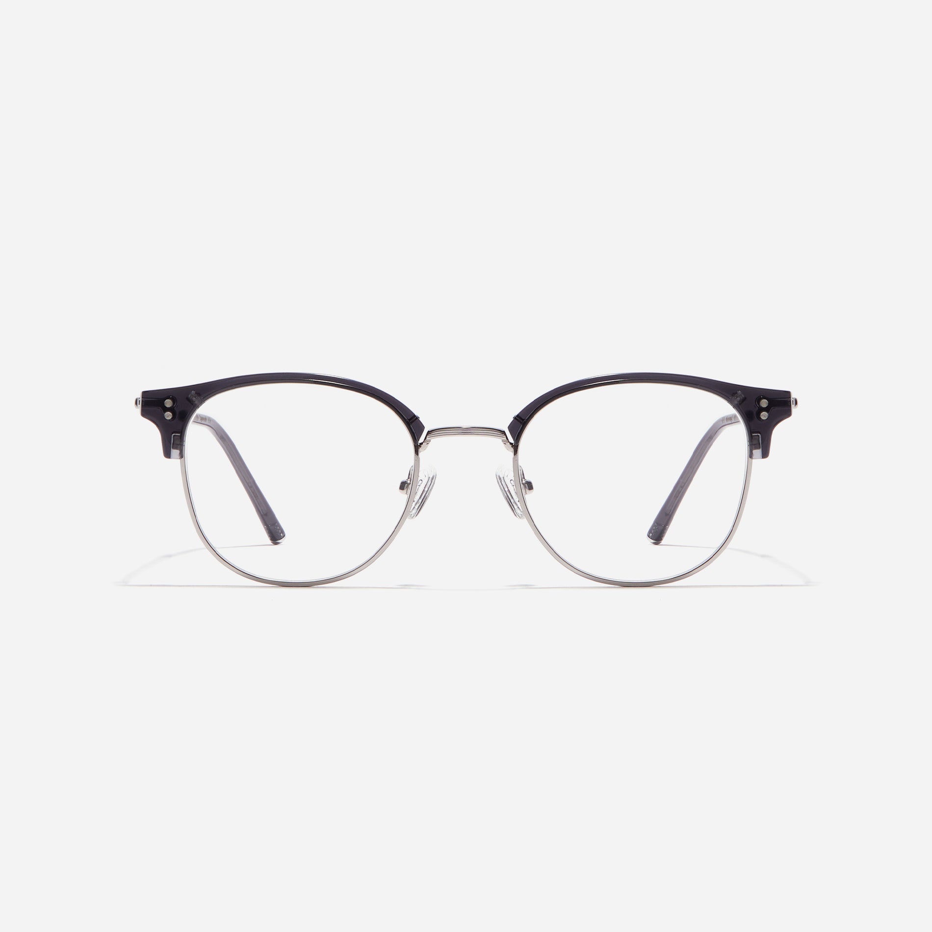 Square-shaped gold-rimmed eyeglasses. The frame, constructed from bioplastic and titanium, seamlessly merges exceptional durability with an ultra-lightweight build, while stylish nose bridge lining details enhance the overall design. The B-titanium temples deliver a lightweight and comfortable fit, guaranteeing prolonged wear without any discomfort.