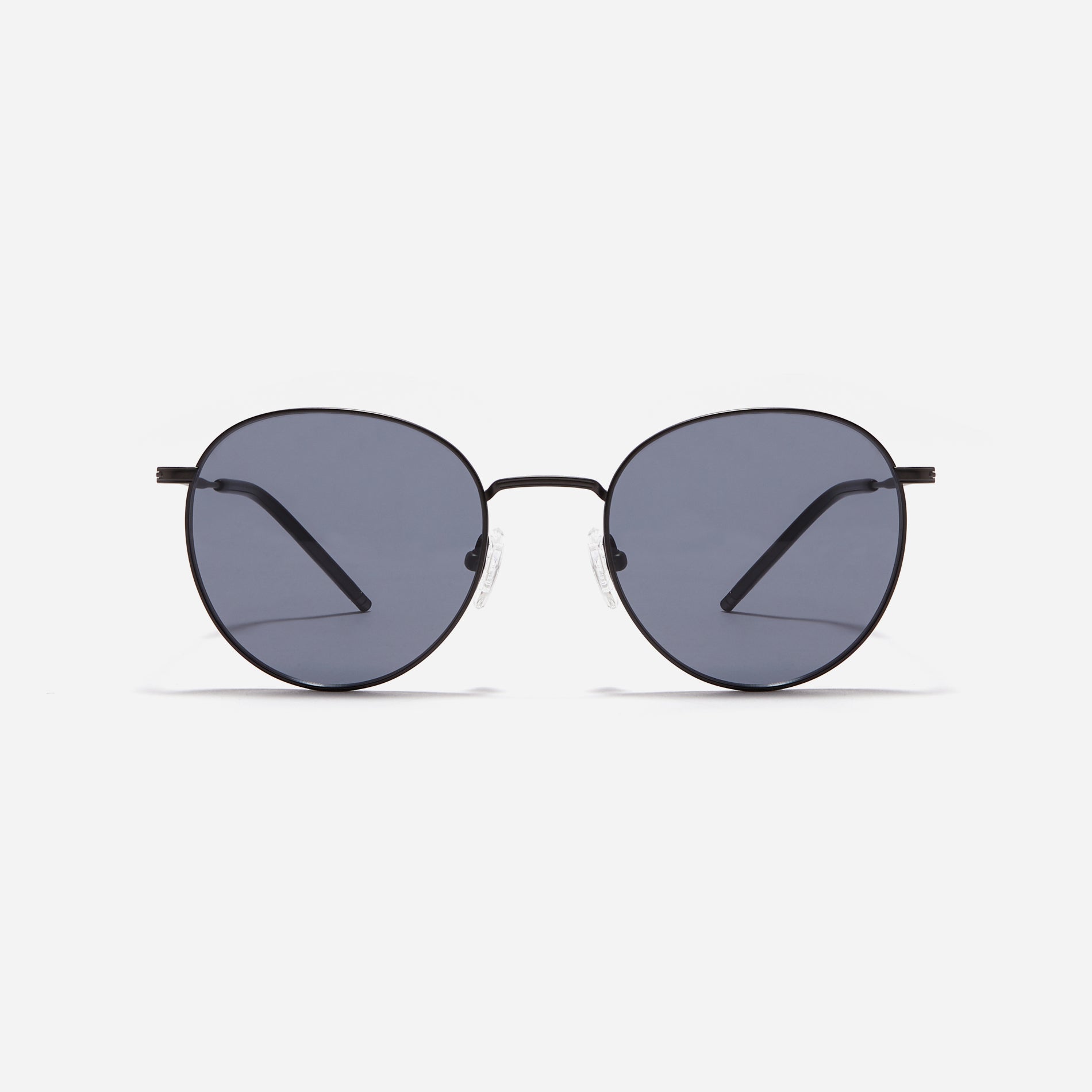 Round-shaped metal sunglasses that offer a soft and natural look with a peach-shaded titanium frame. 