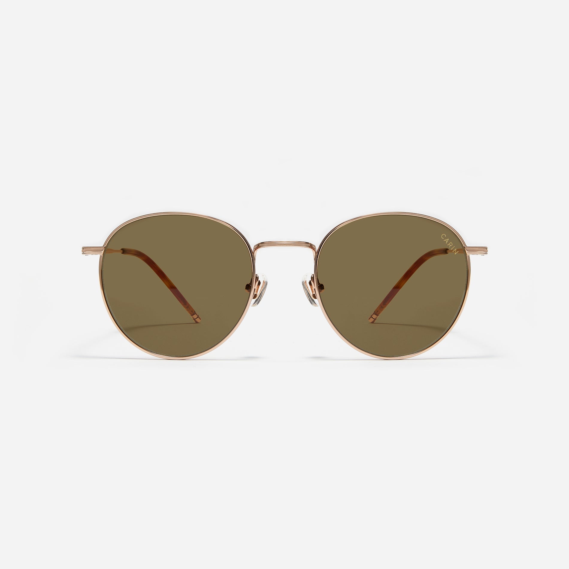 Round-shaped metal sunglasses that offer a soft and natural look with a peach-shaded titanium frame. 