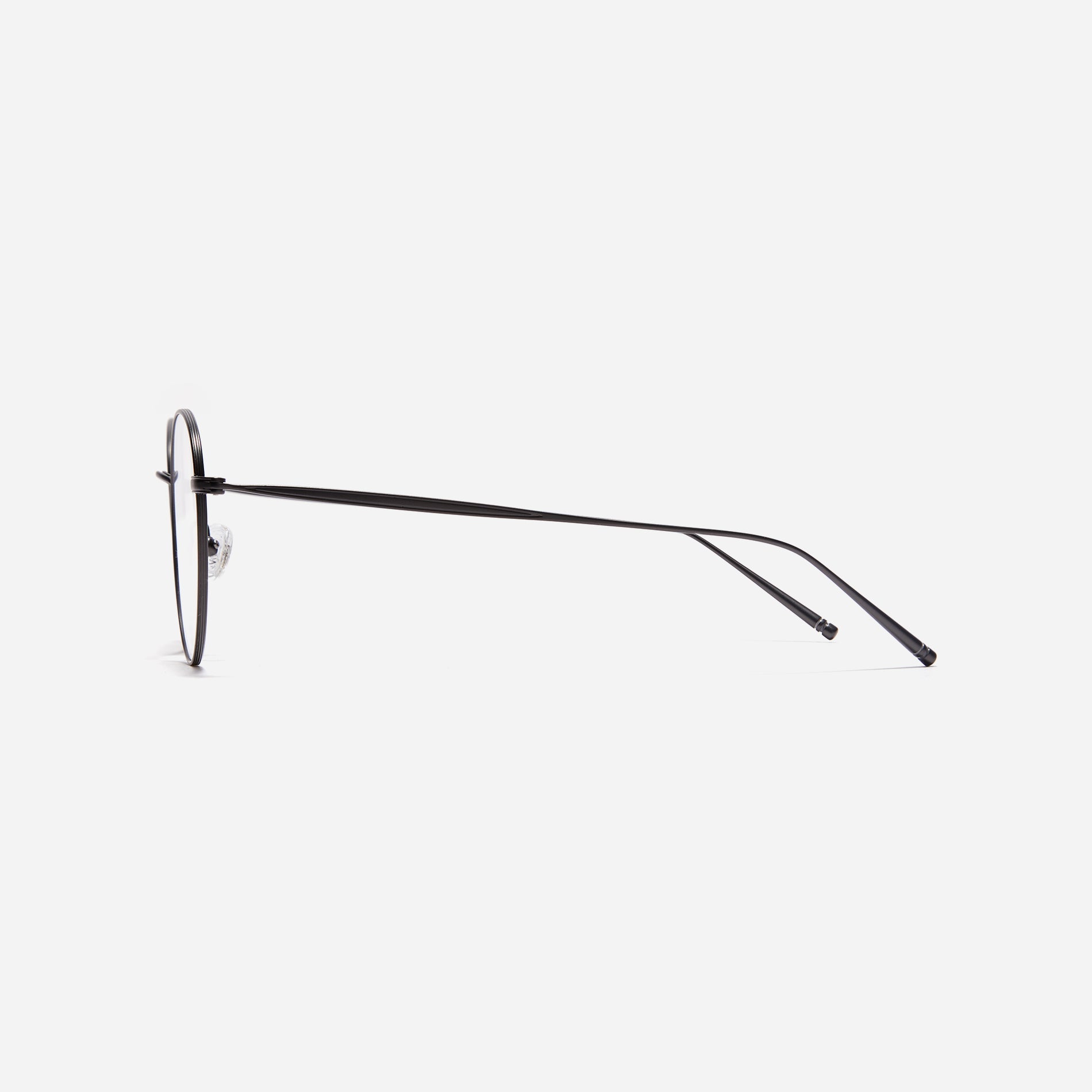Boston-style round-shaped eyeglasses that naturally enhance one's facial features. Crafted entirely from titanium, they guarantee a lighter and more comfortable fit, while modern design makes them a perfect choice for those seeking a contemporary look.