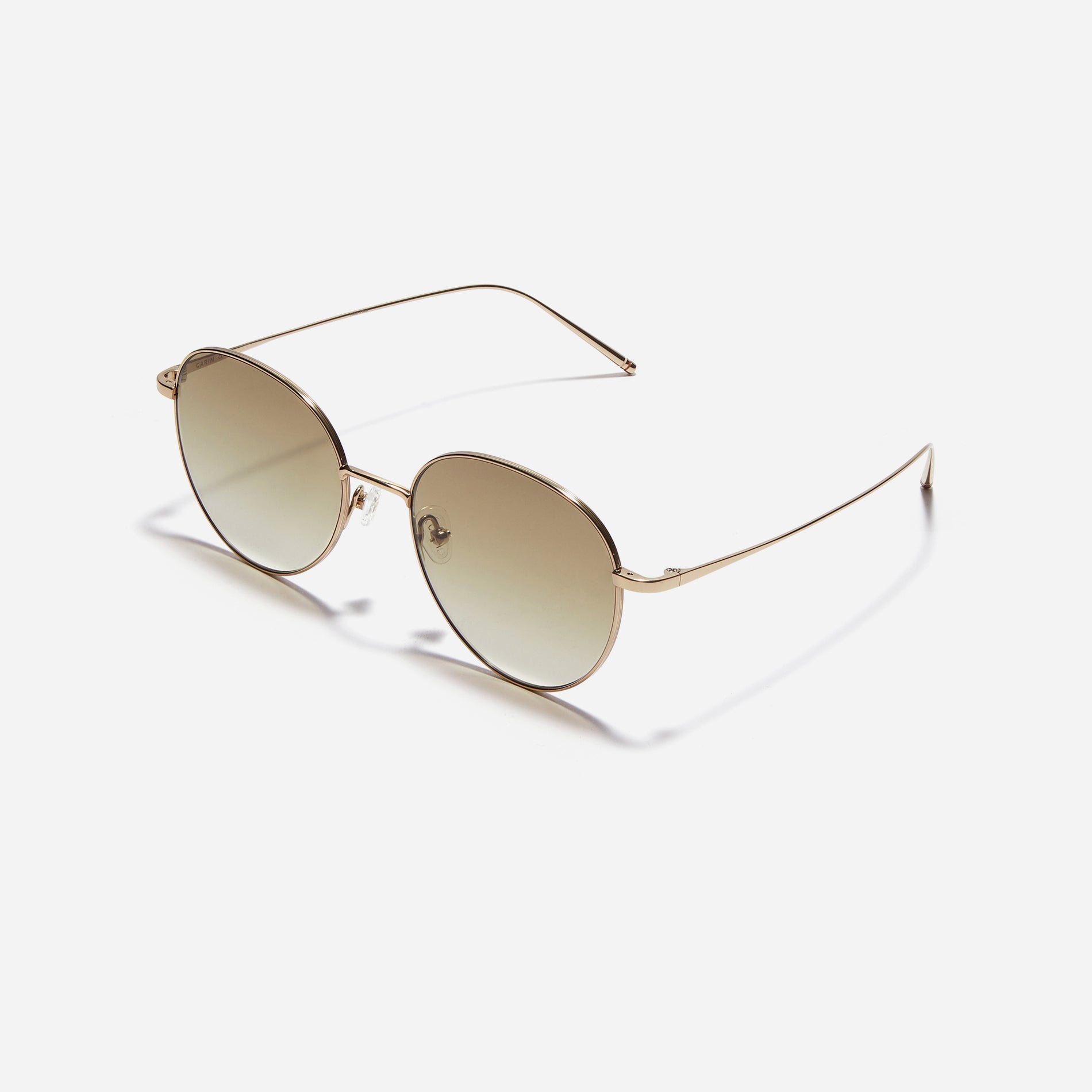 Round-shaped sunglasses crafted entirely from lightweight titanium. They feature semi-mirrored lenses that effectively reflect light, minimizing eye fatigue.