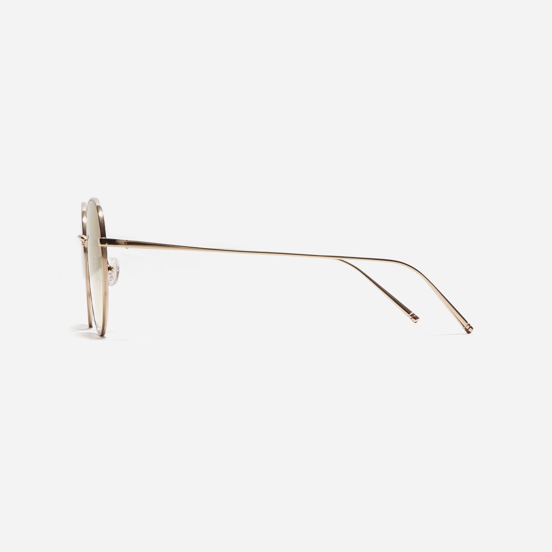 Round-shaped sunglasses crafted entirely from lightweight titanium. They feature semi-mirrored lenses that effectively reflect light, minimizing eye fatigue.
