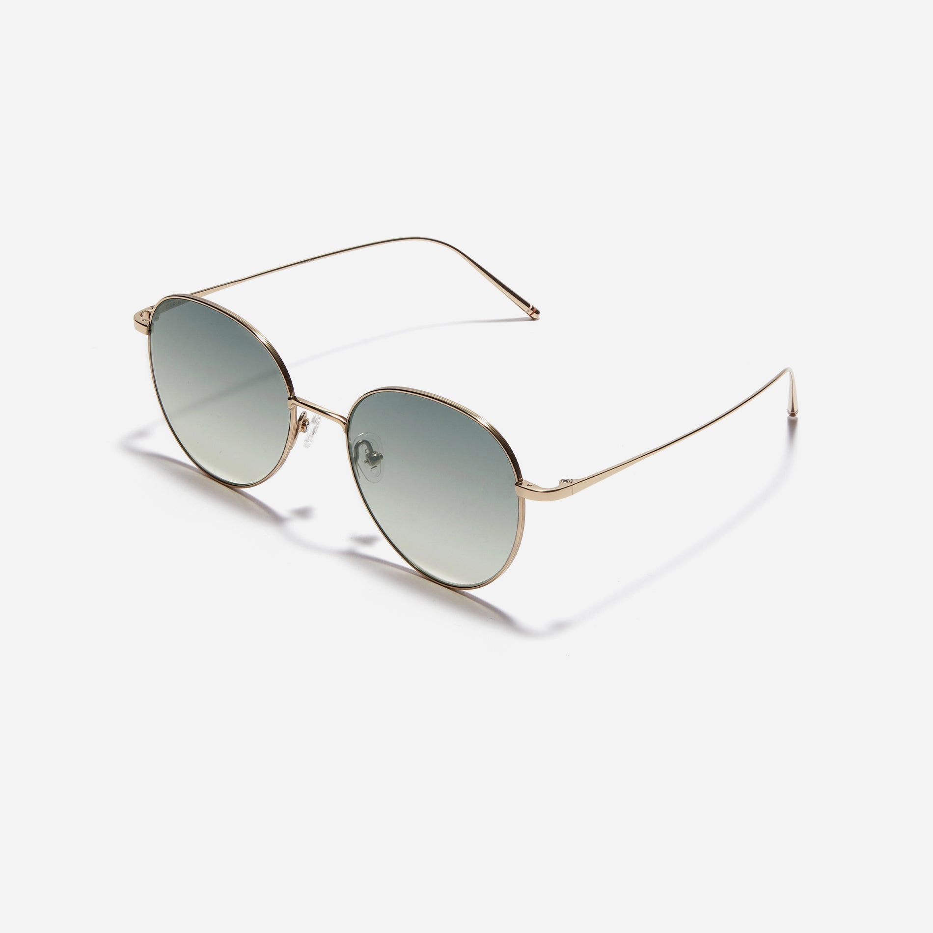 Round-shaped sunglasses crafted entirely from lightweight titanium. They feature semi-mirrored lenses that effectively reflect light, minimizing eye fatigue.