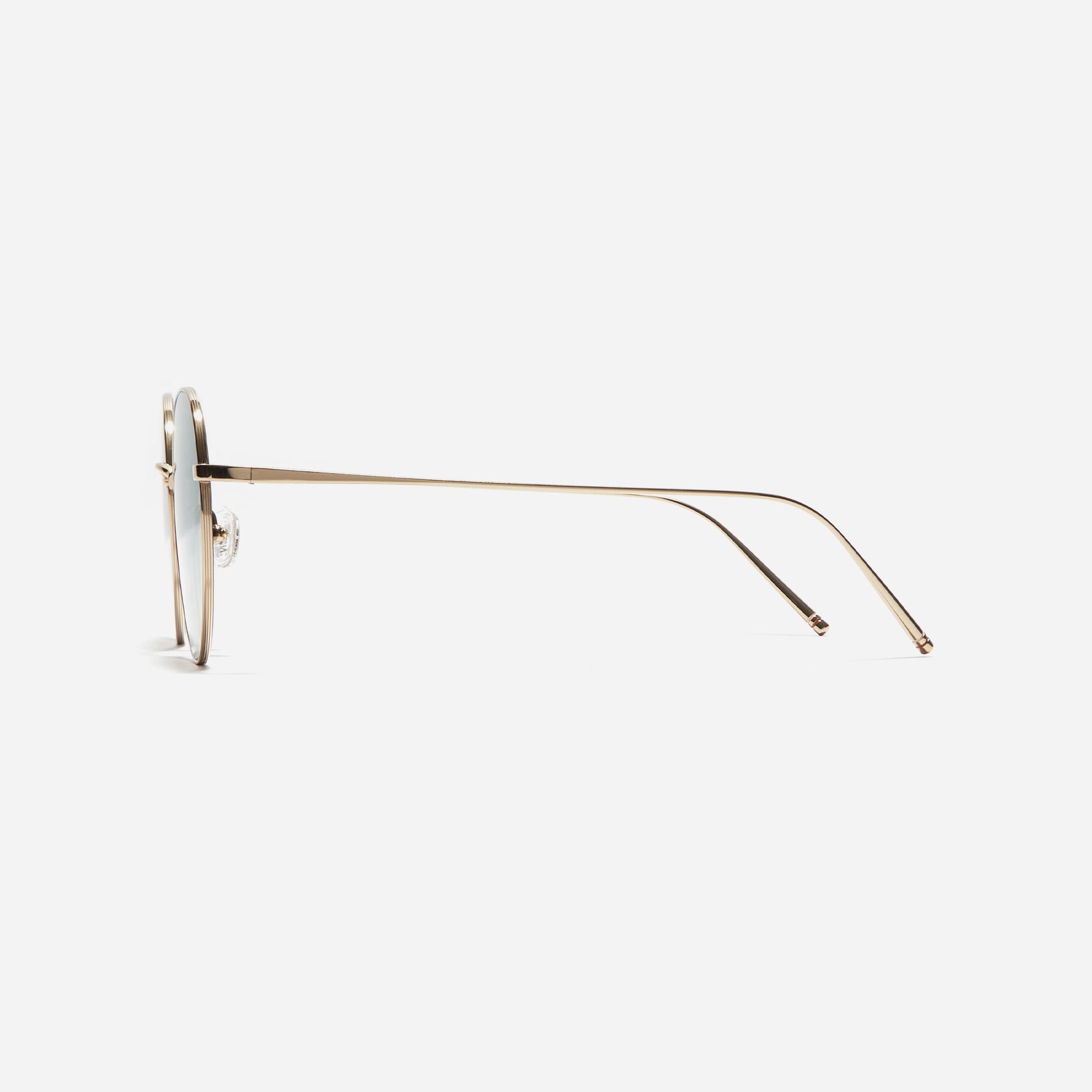 Round-shaped sunglasses crafted entirely from lightweight titanium. They feature semi-mirrored lenses that effectively reflect light, minimizing eye fatigue.