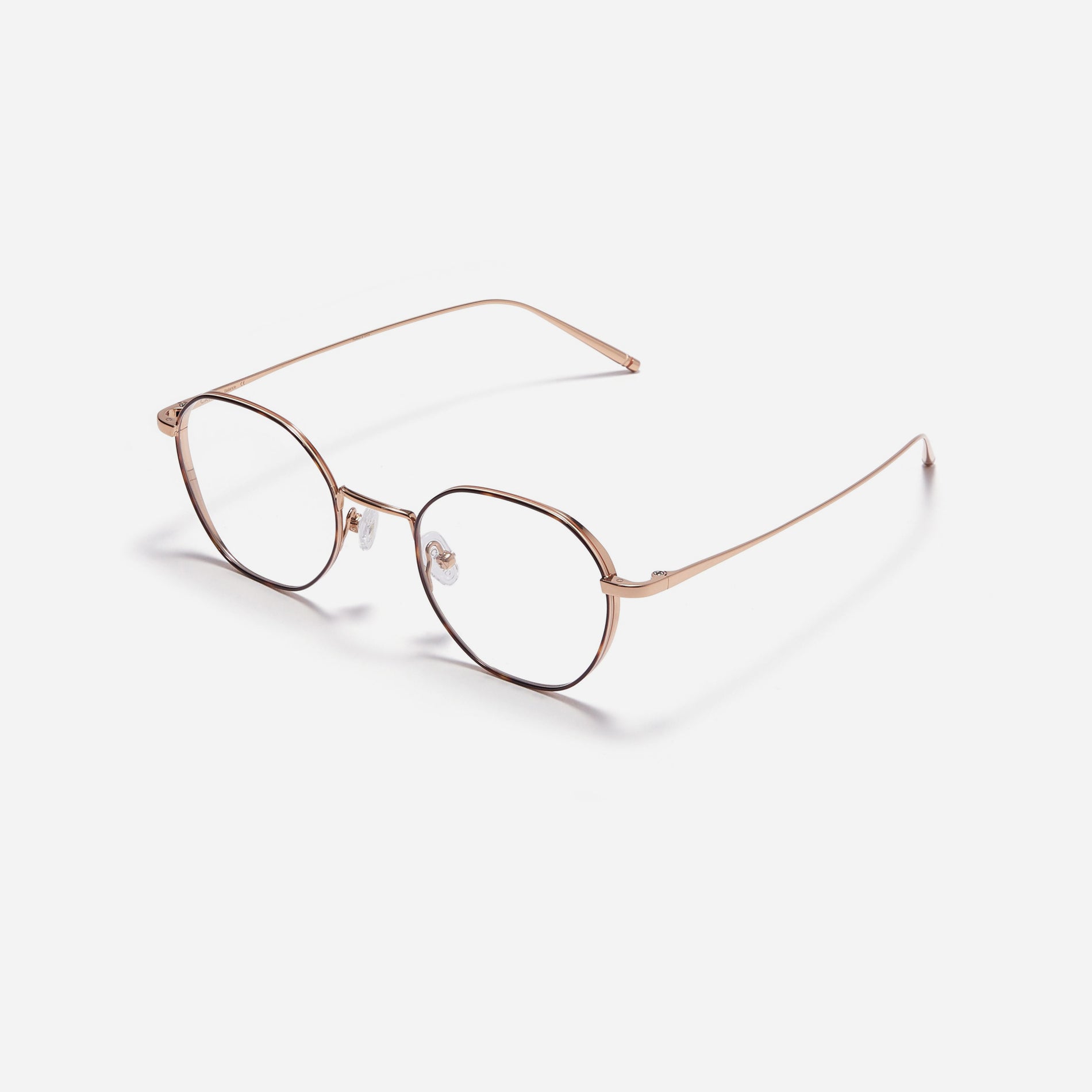 Hexagonal-shaped, full-metal eyeglasses with a dual-rim structure designed to accommodate thicker, high-prescription lenses. Both the frame and temples are made of pure titanium, ensuring a lightweight and comfortable fit.