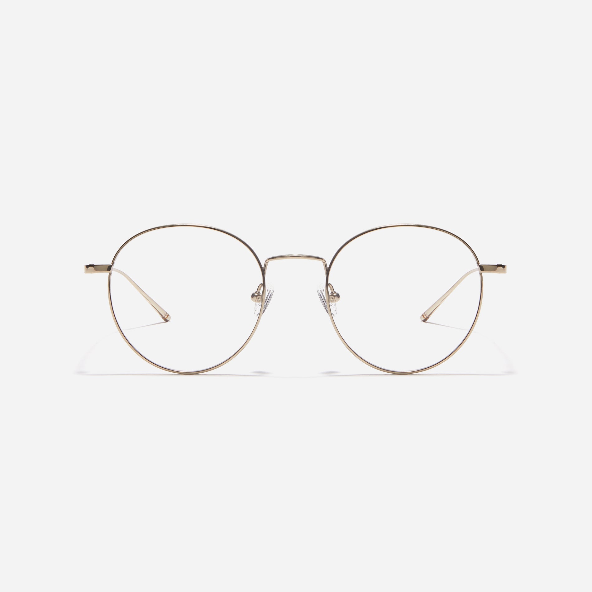Round-shaped eyeglasses that naturally complement all face shapes. Crafted entirely from titanium, the frame provides exceptional durability and featherweight comfort, while its design adds a touch of casual charm to one's daily style.