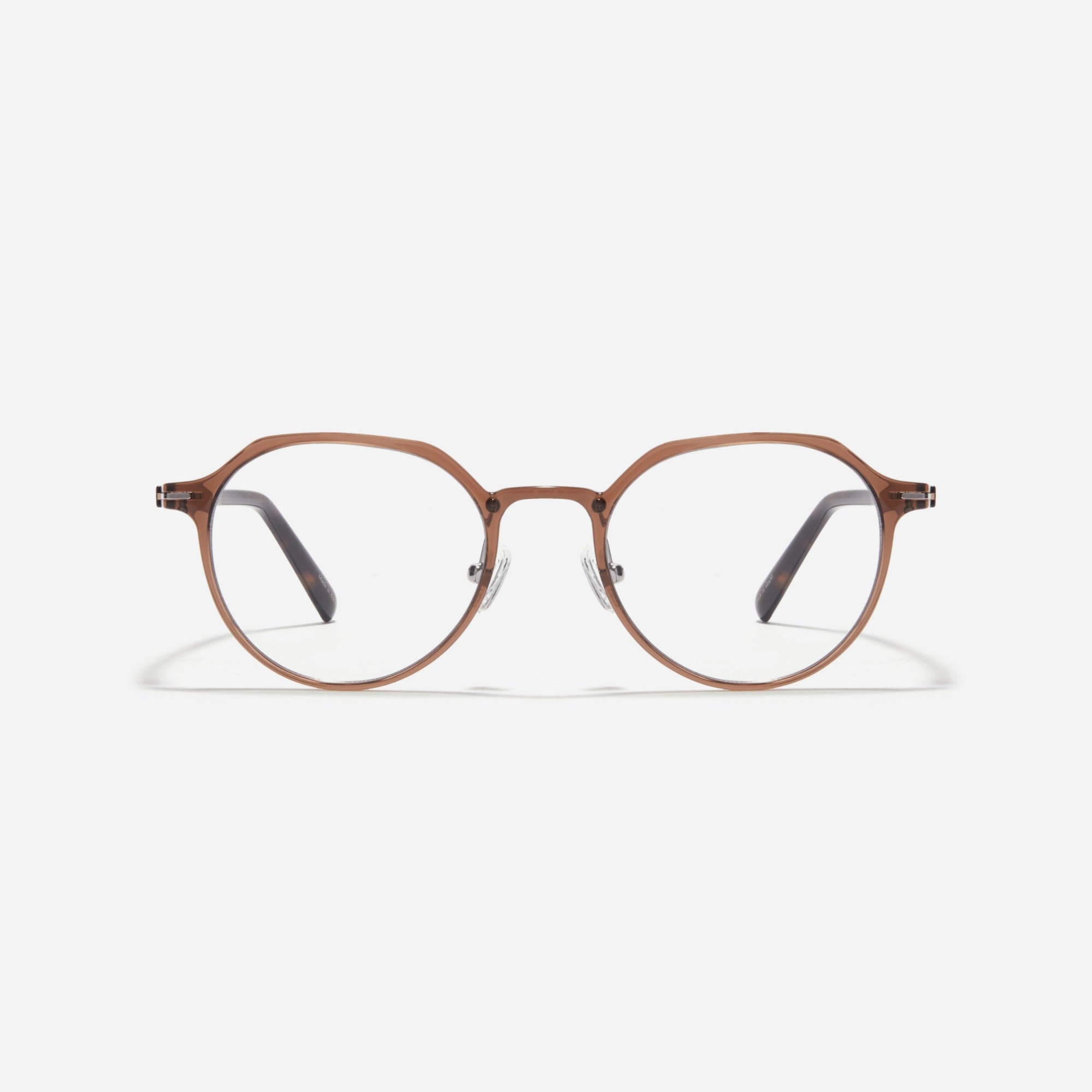 Nils P is a polygon-shaped combination optical frame from the Forest Line. Featuring a bio-plastic front and Ultem temples, it offers a lightweight, comfortable fit with a classic aesthetic.