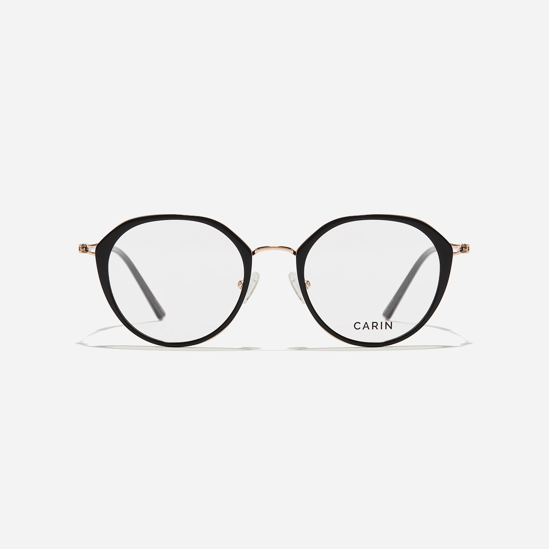 Polygonal-shaped eyeglasses that feature a contrasting round lens design, offering a smooth yet refined style.  They provide a comfortable wearing experience with slim temples made from lightweight and elastic B-Titanium material.