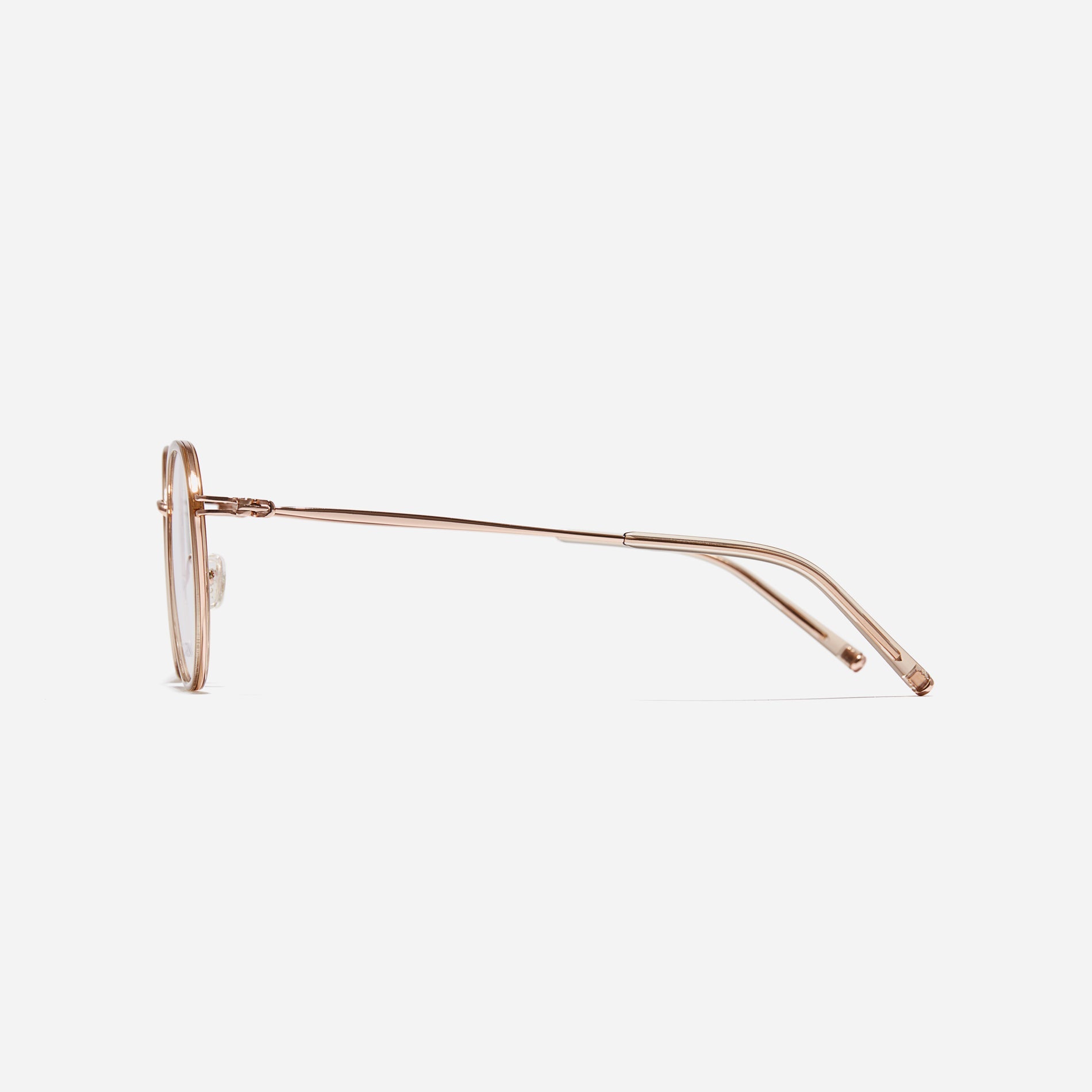 Polygonal-shaped eyeglasses that feature a contrasting round lens design, offering a smooth yet refined style.  They provide a comfortable wearing experience with slim temples made from lightweight and elastic B-Titanium material.