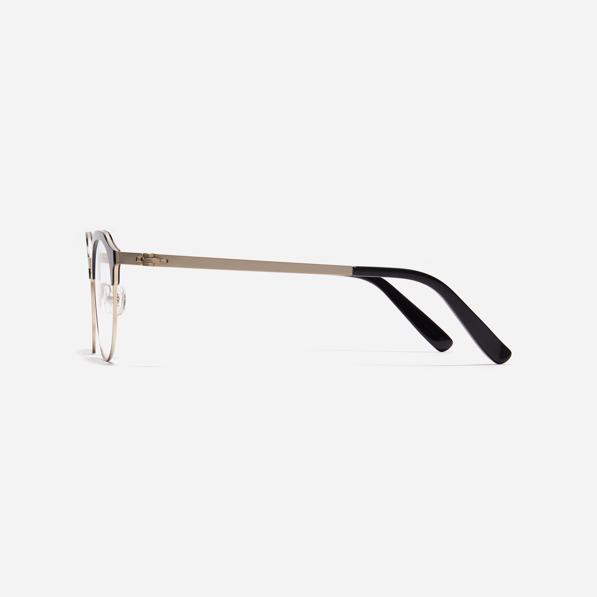 Lightweight polygon-shaped eyeglasses from CARIN's 'Feather Fit' line, offering a contemporary twist on the classic browline design. 