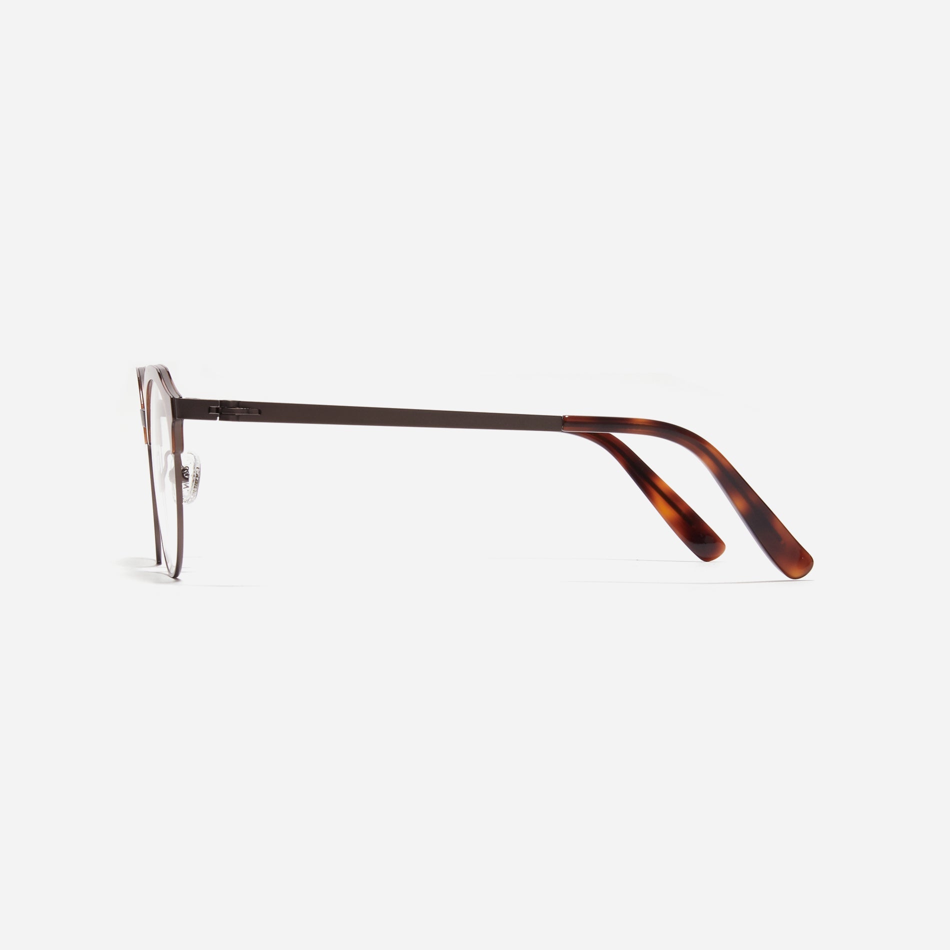 Lightweight polygon-shaped eyeglasses from CARIN's 'Feather Fit' line, offering a contemporary twist on the classic browline design. 