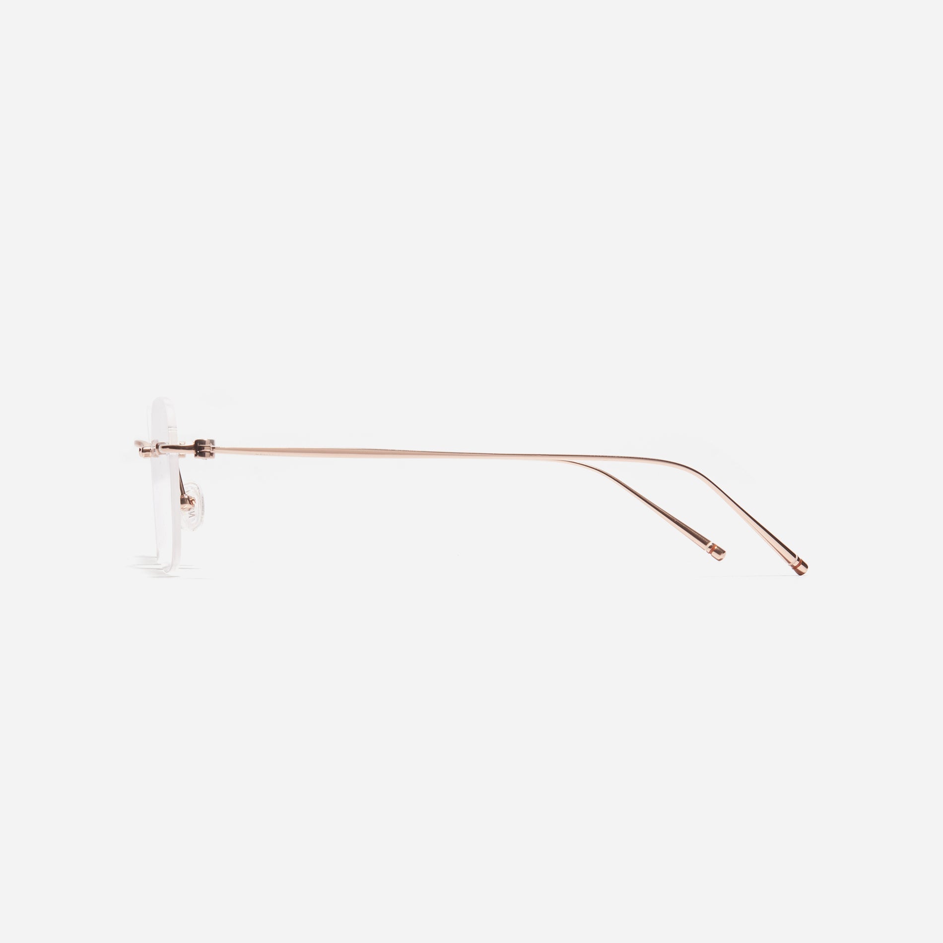 Rimless square-shaped retro eyeglasses. Featuring narrow rims and dual lining on the tips, these eyeglasses ensure a consistently comfortable fit and prevent slipping.